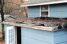 House Roof Damaged In Hurricane Storm