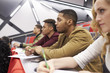 © Monkey Business - Students listening to lecture at university lecture theatre