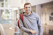 © Monkey Business - Young adult male student in the lobby of a university