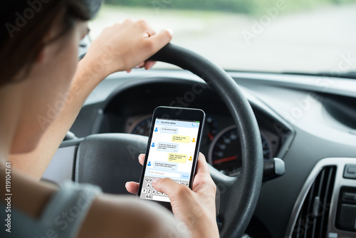 Close-up Of Woman Typing Text Message On Mobile Phone Tableau sur Toile