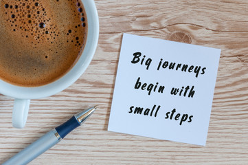 Big journeys begin with small steps, morning inspiration with cup of tasty coffee
