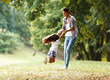 © BalanceFormCreative - Mother and daughter playing, spinning around at the park on a beautiful morning.