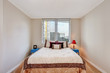 © Iriana Shiyan - Simple beige bedroom interior with brown and creamy tones bed.