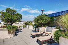 Apartment Building Roof Top Terrace Exterior With Lounge Chairs