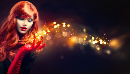Wall Mural - beauty glamour woman with golden magic sparks in her hand