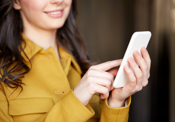 Canvas Print - close up of young woman or girl with smartphone