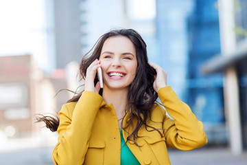 Canvas Print - smiling young woman or girl calling on smartphone