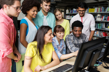 Sticker - international students with computers at library