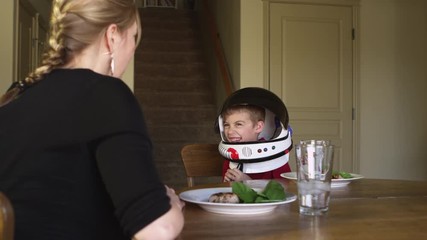 little boy pretending to be astronaut