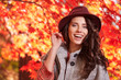 © ZoomTeam - Beautiful elegant woman standing in a park in autumn , Fall conc