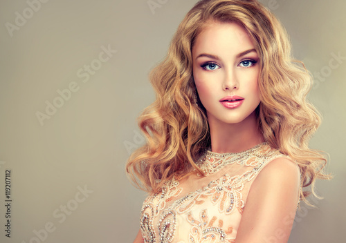 Poster Young beautiful woman, dressed in evening gown