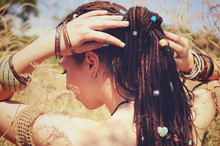Beautiful Young Woman Wearing Dreadlocks Hairstyle Gathered In A Ponytail And Decorated Assorted Beads