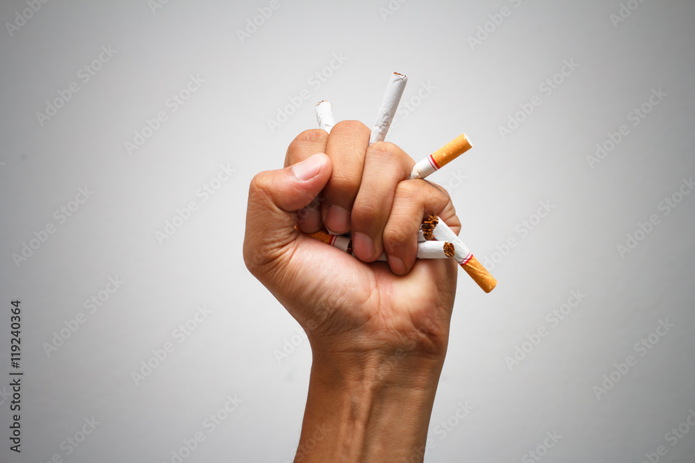 Male hand crushing cigarette, Concept Quitting smoking,World No Tobacco Day  Stock Photo