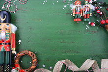 Christmas Background With Ornaments On Green Wood Table.