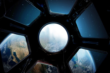 Wall Mural - earth and star in spaceship window porthole. elements of this image furnished by nasa