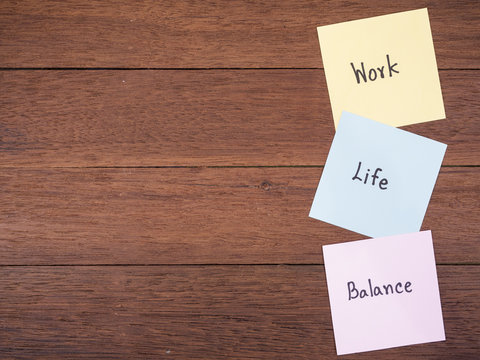 Word spell Work Life Balance on dark wood background 2