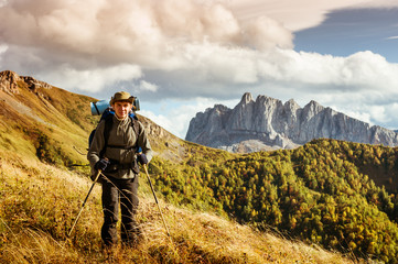 Wall Mural - man hiking in the mountains
