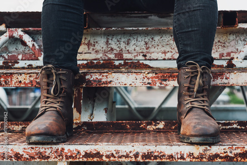 Close Up View On Man S Legs In Black Jeans And Brown Leather Boots On A Bridge At Sunset Men Fashion Toned Picture Buy This Stock Photo And Explore Similar Images At