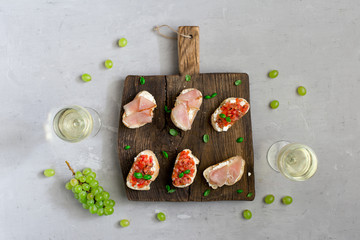 Sticker - Appetizers for wine on wooden board with white wine