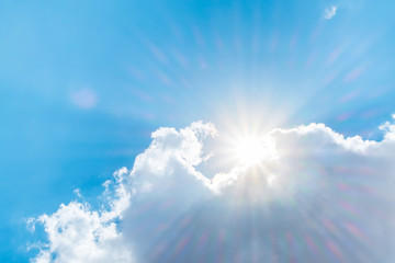 Wall Mural - big white cloud and sunlight ray behind cloud with blue sky