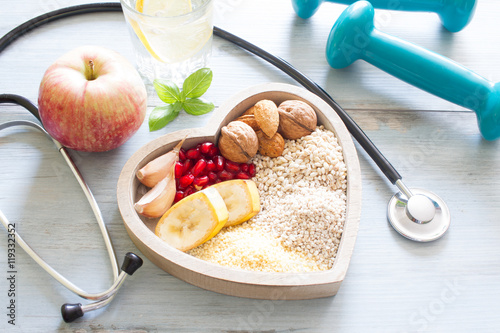 Fotografia Healthy food in heart and water diet sport lifestyle concept