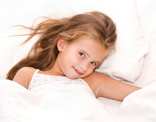 adorable smiling little girl waked up