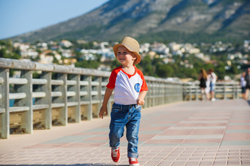 Small cute boy is walking