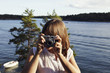 © Johnér - Young woman with camera, Sweden