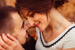 © IVASHstudio - Closeup of cheerful faces of a couple leaning to each other tend
