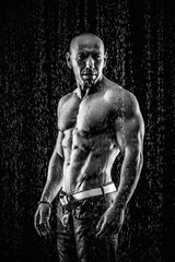 Poster - very muscular handsome athletic man in the rain