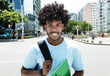 African american male student with typical hairstyle in city