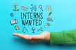 Interns Wanted concept with hand