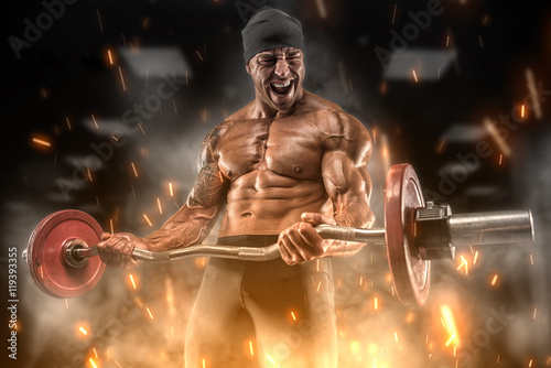 Fényképezés  Angry athlete trains in the gym