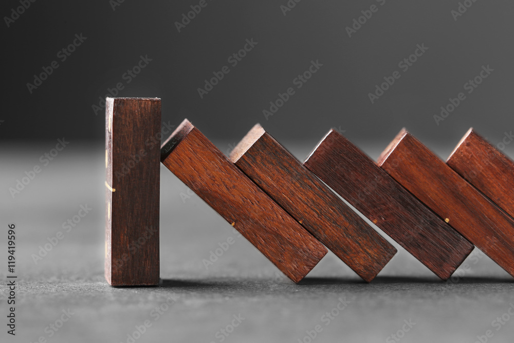 Wooden dominoes on grey table