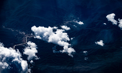 Wall Mural - Aerial view of cloud and sky from airplane window looking down t