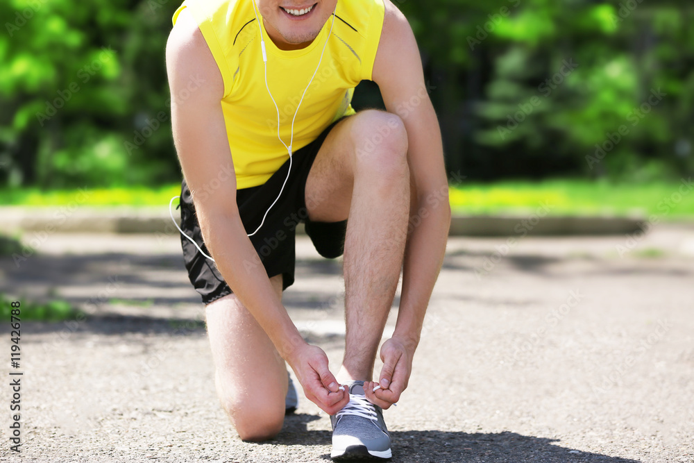 Athlete tying shoelaces