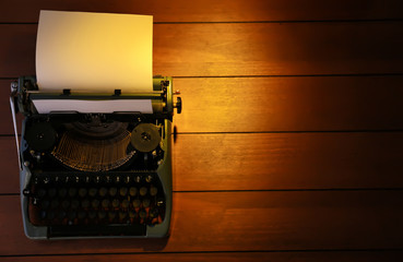 Wall Mural - Typewriter on wooden background, top view