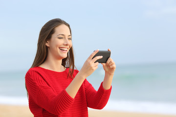 Poster - Girl laughing watching videos in smart phone