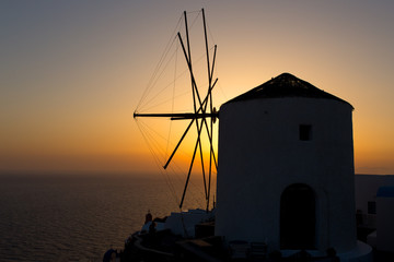 Wall Mural - Old windmill at sunset, Santorini