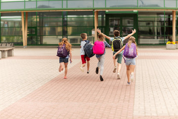 Poster - group of happy elementary school students running