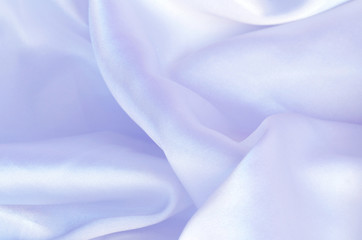 Smooth elegant blue silk, satin fabric background texture