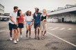 © Jacob Lund - Young friends walking together on the street
