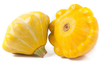 two yellow pattypan squash isolated on white background