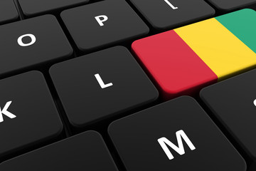 Computer keyboard, close-up button of the flag of Guinea. 3D render of a laptop keyboard