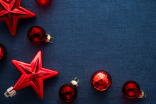 Red Christmas Decorations (stars And Balls) On Dark Blue Canvas Background. Merry Christmas Card. Winter Holidays. Xmas Theme. Happy New Year.
