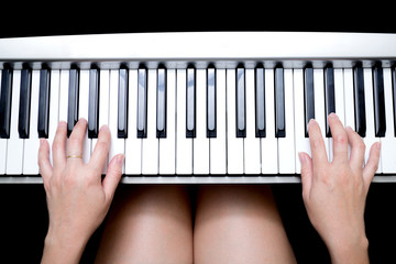 Wall Mural - Beautiful Asian woman's hands playing on piano