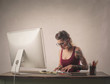 © olly - Concentrated woman using a pc