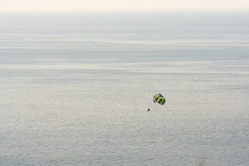 Boat dragging parachute over adriatic sea