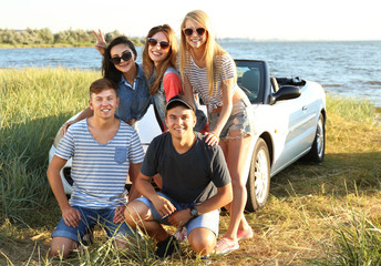 Wall Mural - Happy friends near car