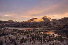 Scenic View Of Lakes Against Mountains During Sunrise